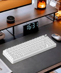 Slick 60 Percent Wired Mechanical Gaming Keyboard With RGB Backlight And Hot Swappable Gasket Mount Featuring Pre Lubed Linear Blueberry Switches And Aluminum Volume Knob For A Top Shelf Typing Setup In Clean White on a modern desk.