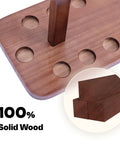 Close-up of wood base on wood floor standing fishing rod storage rack for garage holds up to fourteen rods or combos.