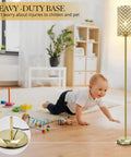 Gold Crystal Floor Lamp With On Off Foot Switch in living room, elegant design with crystal shade, sturdy 7 lb base, toddler nearby.