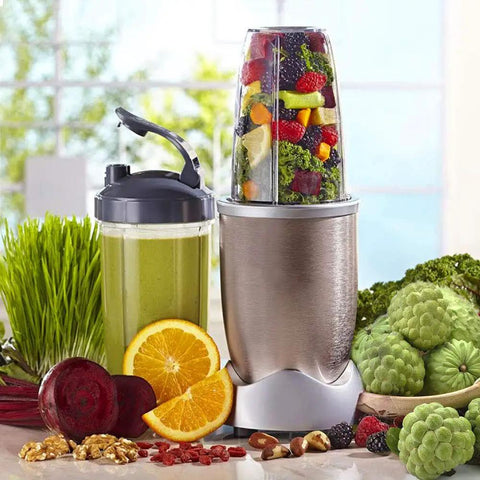 Blender filled with fruits and vegetables on counter with green smoothie, featuring Top Notch Eight Piece Blender Replacement Blade Kit For 600W And 900W High Speed Blenders With A Four Inch Six Fin Stainless Steel Blade Includes Two Rubber Gaskets Three Shock Pads Motor Top Base Gear And Rubber Gear For Easy Install.