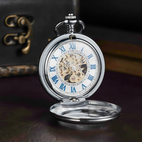 Mechanical Pocket Watch With Magnifier Case And Half Hunter Engraved Silver Chain Skeleton Dial Roman Numerals Classic Vintage Style For Men And Women Jewelry Quality Timepiece For Casual Or Business Wear, open showing skeleton dial and blue Roman numerals.