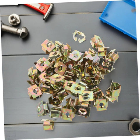 Heavy Duty 50 Pack Golden Iron Captive Nut Car Body Clips Street Tough Bumper Retainers And License Plate Fasteners built for rough terrain, showing gold-coated clips.