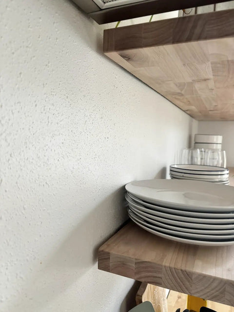 Heavy Duty Floating Shelf Brackets Fifty Eight Inches Long Invisible Mantel Supports For Thick Lumber Boards Matte Black Alloy Wall Mount Holders displaying white plates on a wood shelf.