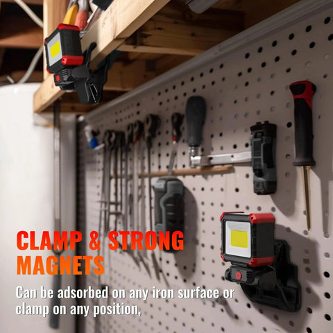 Rechargeable LED Work Light With Clamp And Magnetic Clip 2100 Lumen COB Portable Work Light on pegboard in workshop