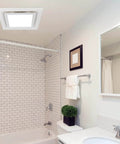Quiet Bathroom Exhaust Fan With Light 112 CFM 1.0 Sones 6000K LED panel installed in a tiled bathroom ceiling