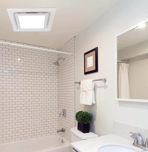 Quiet Bathroom Exhaust Fan With Light 112 CFM 1.0 Sones 6000K LED panel installed in a tiled bathroom ceiling