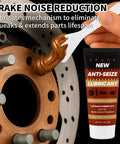 Applying copper anti-seize brake lubricant to brake rotor for noise reduction and easy disassembly in automotive maintenance.