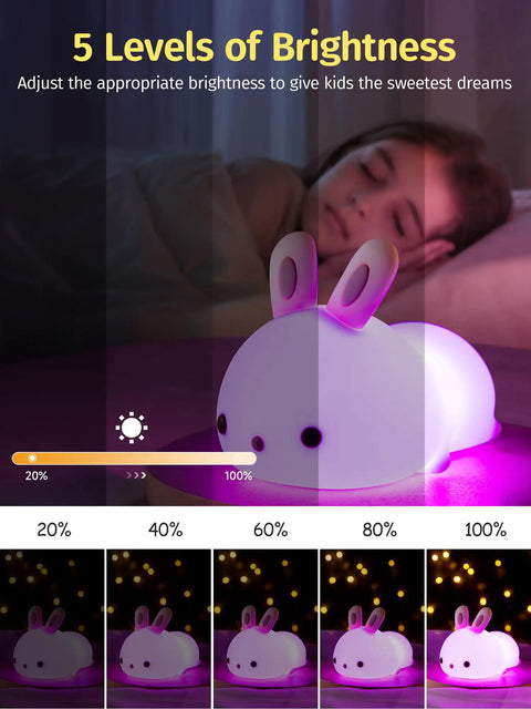 Lit Cute Bunny Night Light For Kids With 16 Colors Tap Control Dimmable Lamp in 5 Brightness Levels beside sleeping child