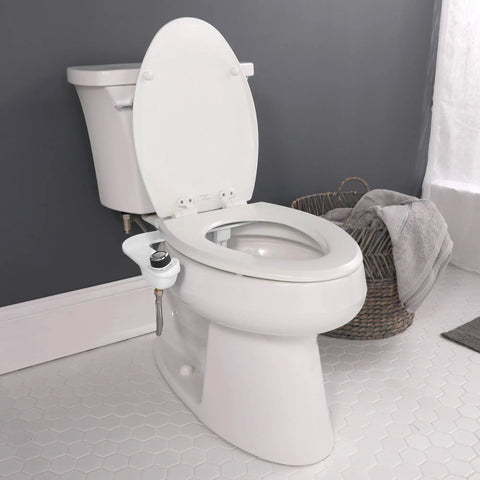 SlimEdge Non Electric Bidet Attachment For Toilet With Dual Front And Rear Nozzles Cold Water Wash installed on white toilet.