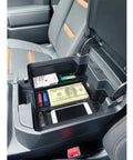 Center Console Organizer Tray For Full Size Trucks Fits Silverado 1500 Sierra 2500HD 3500HD With Bucket Seats Black Durable ABS Plastic Easy Install In Cabin Storage Boost For Your Ride showing organized storage of phone, money, and small items inside truck console.