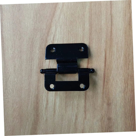 Front view of a black iron heavy-duty cabinet hinge with two mounting plates and screw holes on a wooden surface.