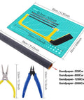 Must-Have 87-Piece Model Tool Kit For Gunpla And Hobby Building Pro Grade Craft Set with cutting pad, saw, pliers, sandpaper.