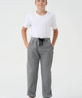 Boy wearing grey joggers with a drawstring, part of Three Pack Boys Sweatpants Fleece Joggers With Zipper Pockets Cozy Everyday Lounge And Gym Class Ready