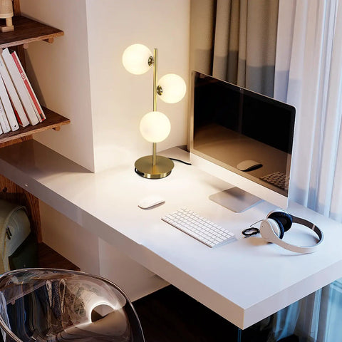 Three Light Brass Bedside Lamp With Mid Century Globe Shade In White And Gold For Reading In Office Living Room Dresser And Bathroom G9 Base Perfect Retro Modern Vibe And Cozy Nightstand Ambience on a desk