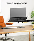 Adjustable Laptop Desk Mount Arm For 17 Inch Laptops And 32 Inch Monitors, Holds Up To 22 Lbs, shown mounted on a desk.