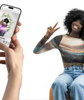 Person using iPhone to print a photo with Instax Mini Link 3 Smartphone Printer; woman sitting and holding phone.