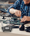 Helping Hands Solder Stand With Adjustable Clamps And Flexible Arms For DIY PCB Repair on workbench with soldering tools