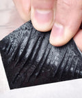 Heavy Duty Self Sealing Asphalt Repair Tape With Aluminum Foil Roof Protector Roll For Gutters And Surface Cracks waterproof patch being pulled.