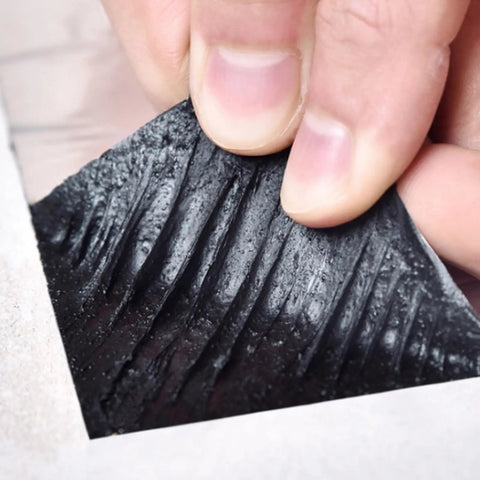 Heavy Duty Self Sealing Asphalt Repair Tape With Aluminum Foil Roof Protector Roll For Gutters And Surface Cracks waterproof patch being pulled.