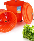 Heavy Hitter Commercial Salad Spinner With 5.5 Gallon 20 Quart Capacity orange plastic parts with fresh lettuce beside.