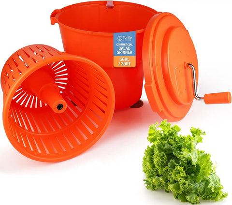 Heavy Hitter Commercial Salad Spinner With 5.5 Gallon 20 Quart Capacity orange plastic parts with fresh lettuce beside.