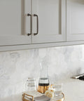 Kitchen with Kane Black Bronze Cabinet Pull Transitional Style Drawer Handle for Cabinets and Furniture installed on gray cabinets.