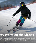 Skier wearing all season balaclava face mask for men and women with UPF 50 plus UV protection on snowy slope, vibrant gear