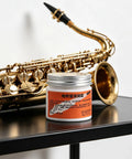 All In One Conductive Grease for Electronics and Woodwinds, 3.53oz White Paste Delivers Stable Conductivity, Safe on Nickel, Brass, and Gold Connectors, Keeps Wind Instrument Switches Smooth and Refurbishes Worn Parts. Jar with saxophone
