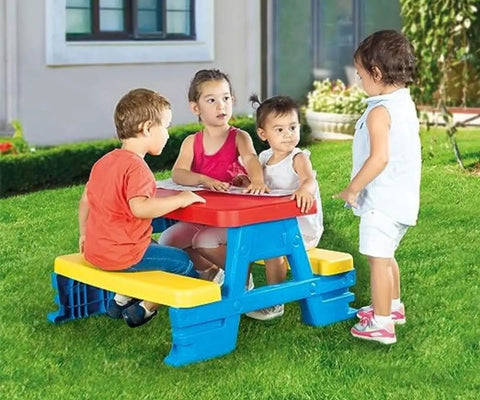 Big Plastic Picnic Table For Four Kids For Indoor And Outdoor Use with children seated on colorful benches outside