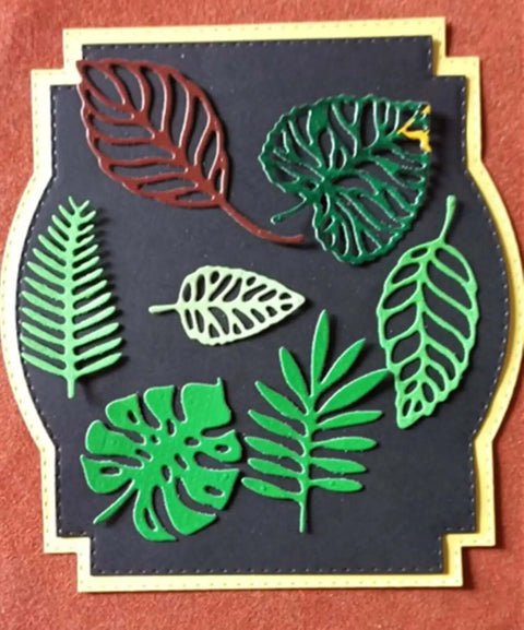 Totally Seven Piece Leaf Die Cut Set For Scrapbooking And Card Making, showcasing various plant and flower leaf shapes on a card.
