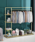Top Shelf Golden Metal Garment Rack With Five Tier Storage Shelves Portable Clothes Hanging Organizer Zero Hassle Closet Setup For Coats Pants Shoes And Weekend Gear with shirts displayed.