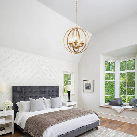 Gold Orb Chandelier Pendant Light Three Light Globe Fixture Modern Luxury Dining Room Foyer Kitchen Bedroom With Adjustable Height Openwork Metal Spheres For A Luxe Glam Vibe in bedroom setting.