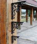Built Tough Heavy Duty Cast Iron Wall Shelf Brackets Rust Proof 90 Degree Corner Braces on wooden post, showcasing elegant black metal design.