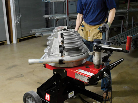 Gardner Bender B2000 Cyclone Electric Conduit Bender For 1/2 To 2 Inch Emt Rigid Al And Imc Pipe, shown in use with pipe.