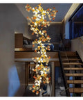 Premium Branch Style Crystal Chandelier With Antique Brass Finish elegant ceiling fixture, showcasing intricate floral design in upscale interior.