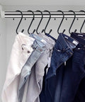 12 Pack Four And A Half Inch Vinyl Coated S Hooks Heavy Duty Non Slip Closet Hooks For Hanging Jeans, shown hanging in a closet