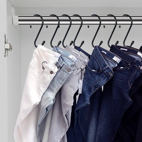 12 Pack Four And A Half Inch Vinyl Coated S Hooks Heavy Duty Non Slip Closet Hooks For Hanging Jeans, shown hanging in a closet
