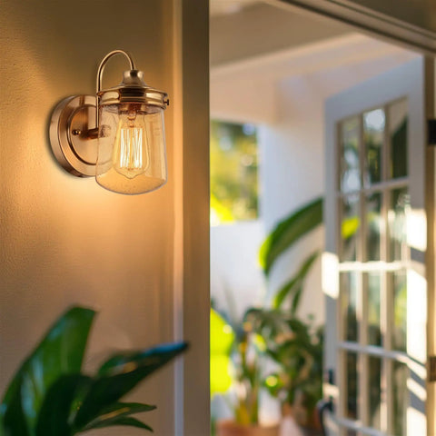 Wall-mounted sconce with seed glass shade on patio