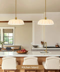 puncoll 15.7 Vintage Milk Glass Pendant Light Kitchen Island above a modern kitchen island with elegant design.