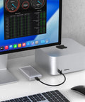 Fanless Thunderbolt 5 Nvme Enclosure For Pcie M2 Drives Up To 8tb with aluminum shell connected to desktop.