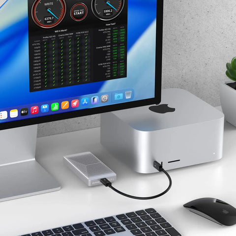 Fanless Thunderbolt 5 Nvme Enclosure For Pcie M2 Drives Up To 8tb with aluminum shell connected to desktop.