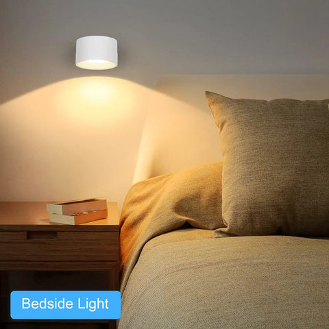 Bedroom scene with Cordless Rechargeable LED Wall Sconces 2 Pack With Magnetic Touch Dimmer, above a bedside table.