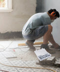 Person using tools with Heavy Duty Toggle Bolt And Wing Nut Kit With 48 Piece Carbon Steel Wall Anchors visible in a box