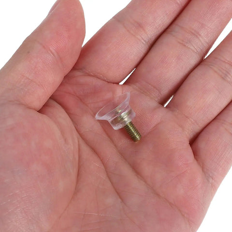 Close-up of a 10 Pieces Screw In Furniture Pad in a hand, featuring a durable plastic and iron slider for sofas and tables.