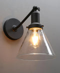 Industrial Vintage Wall Sconce Light Fixture With Slope Pole Mount And Funnel Flared Clear Glass Shade, Matte Black Finish, E26 Base Compatible, Dimmable With Bulbs, 60W Max, 110-120V on wall