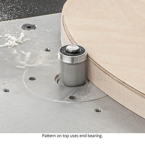 Router bit from Badass Four Piece Router Bit Set with alternating shear geometry cutting a wooden circle on the router table.