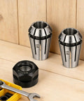 ER11 Spring Collet Set 1/4 Inch CNC Lathe Milling Tool Chucks with Clamping Nut on wooden background