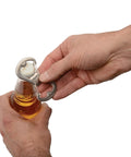 Person using Dual Bottle Opener And SBiner Carabiner Combo In Stainless Steel with double sided openers to open a bottle.