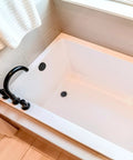 Mushroom Toe Drain Tub Trim Set With Floating Faceplate In Dope Matte Black Finish Easy Toe Activated Drain Plug in modern bathtub