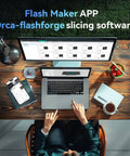 Person using a laptop and tablet with Flash Maker APP and Orca-flashforge slicing software at a wooden desk.